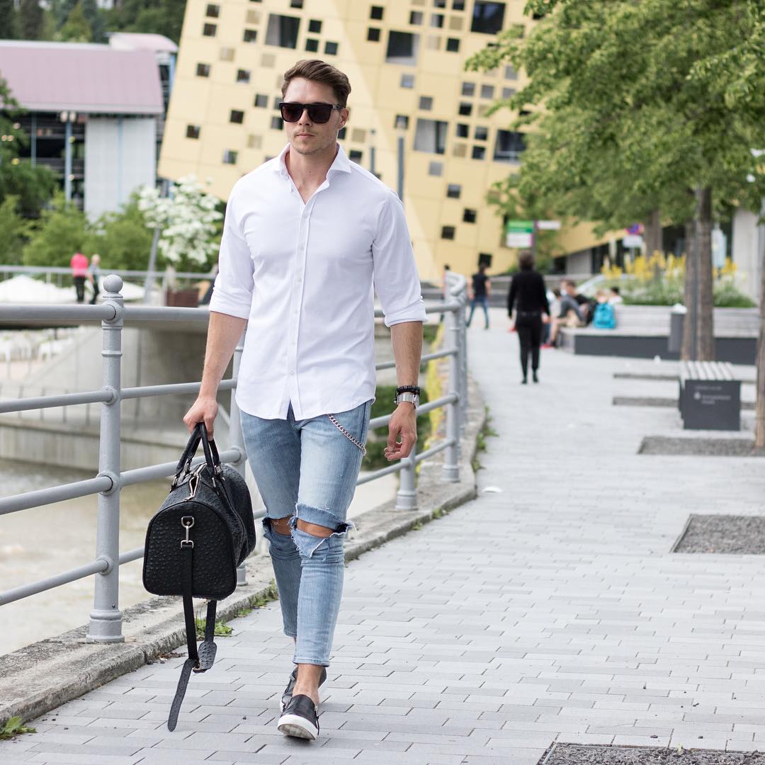 We rounded up 8 amazing looks you can try with your white shirt, from pairing it with ripped denim or cool chinos.   Now, to help you style your white shirt right, we’ve put together 8 insanely cool photos of guys wearing a crisp white shirt.
