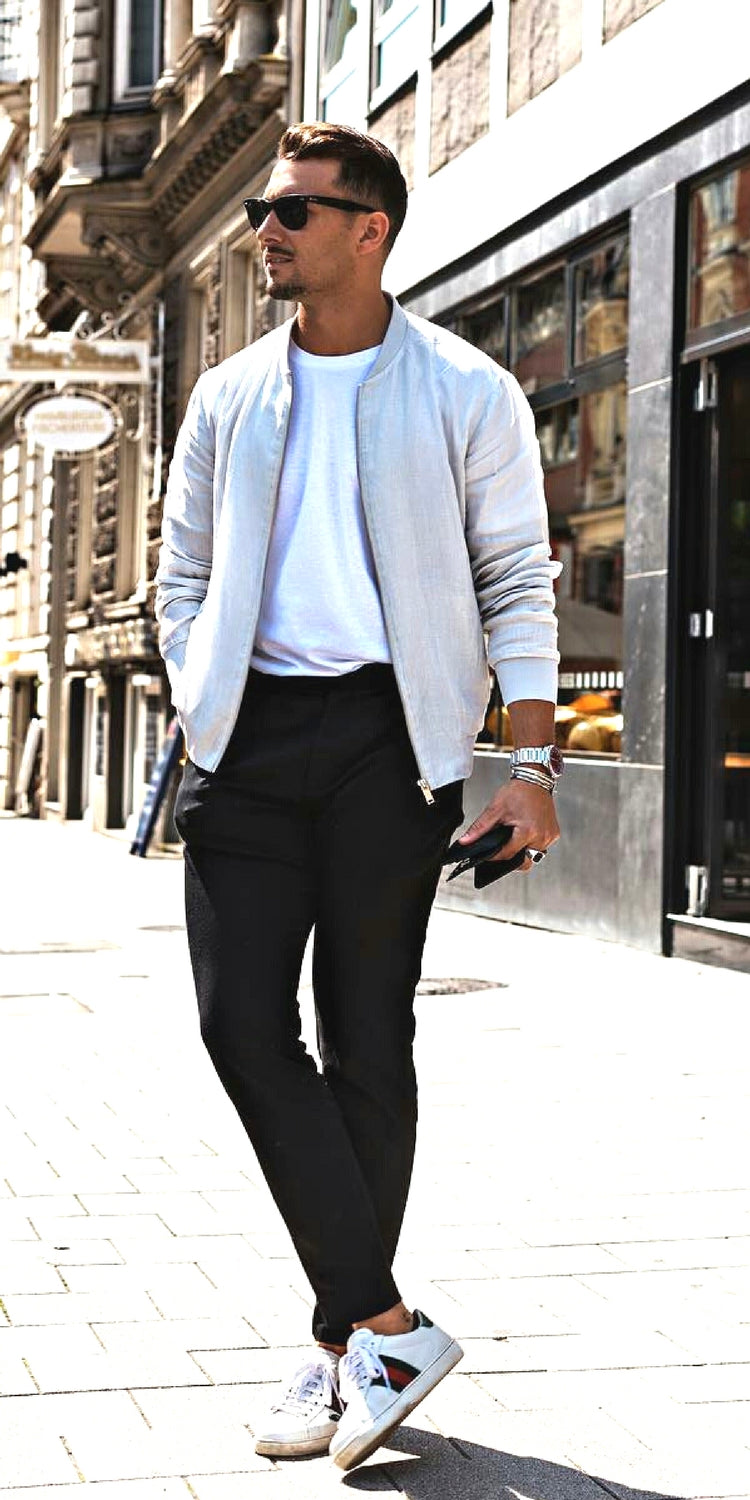 Black pants + White crew neck t-shirt + Beige bomber jacket + White sneakers