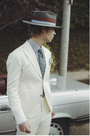 A model wearing a white suit